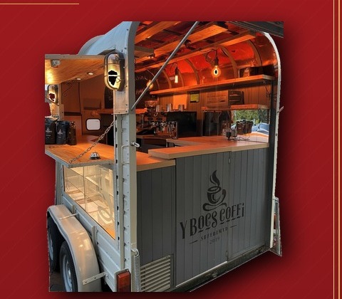 Y Bocs Coffi — restored horsebox serving specialty coffee from a warm timber-lined interior